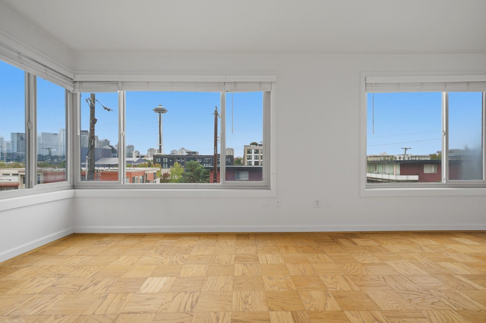 Living room windows with a Space Needle view
