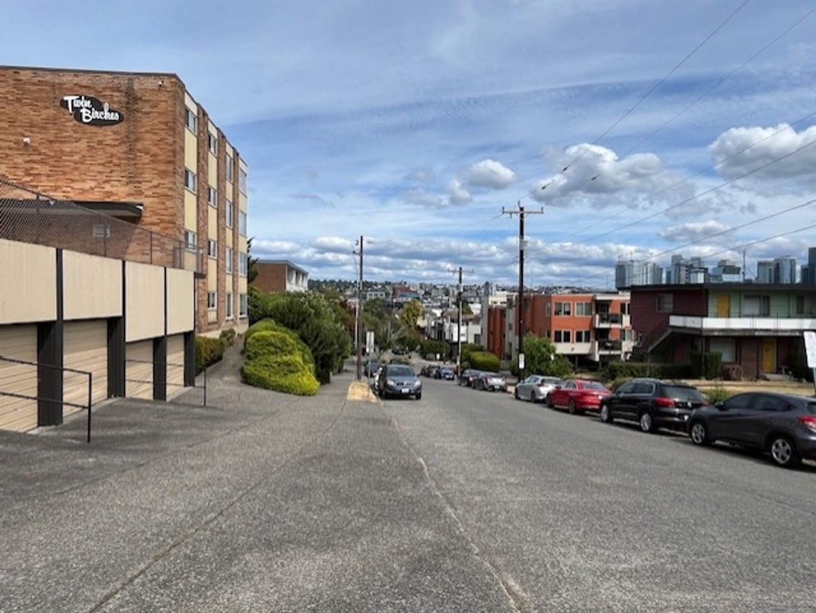 Closer view of garages, brick facade and Valley Street